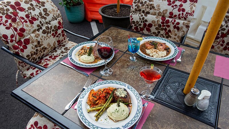 Multiple entrees on outdoor dining table